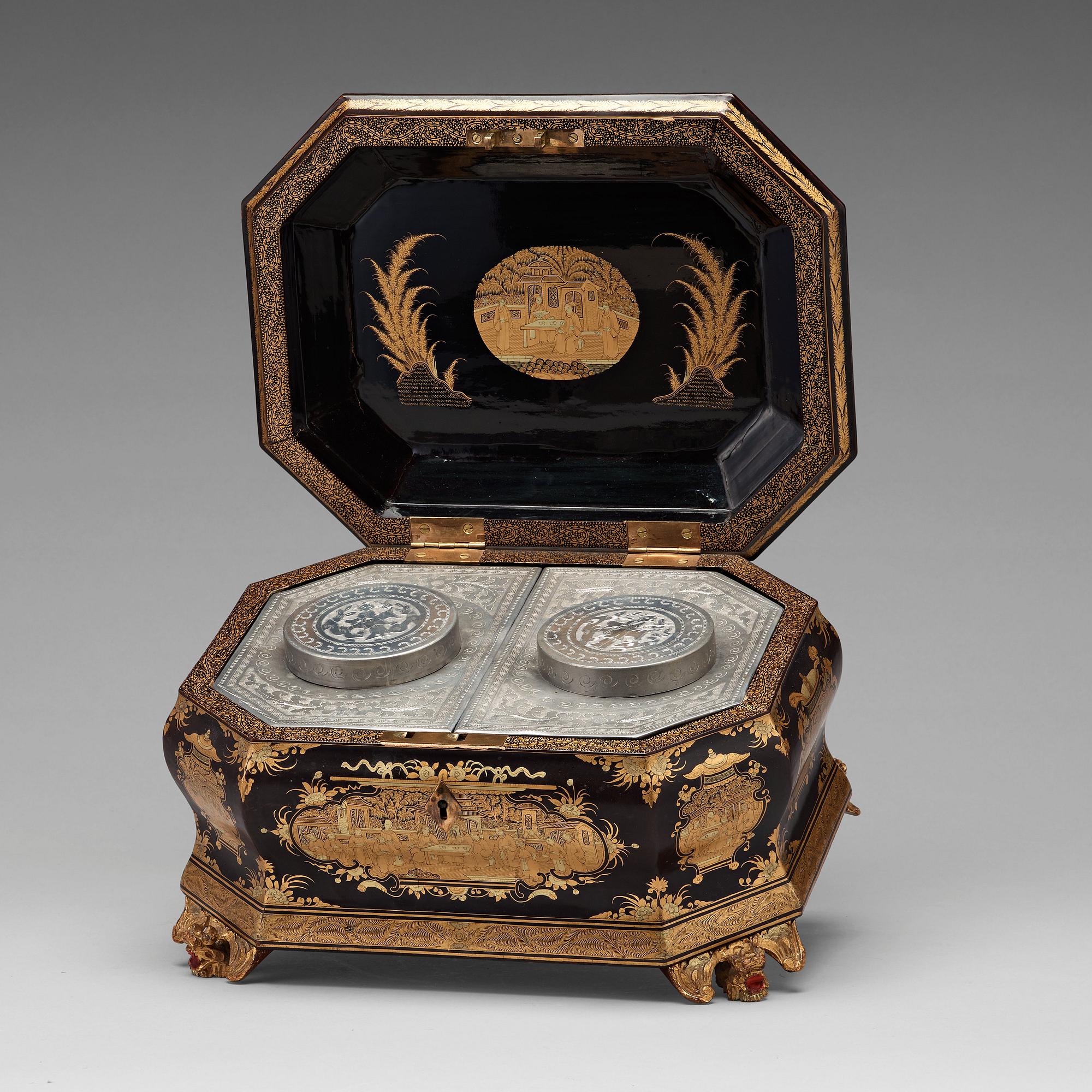 A lacquered tea box with pewter canisters, Qing dynasty, late 19th Century.