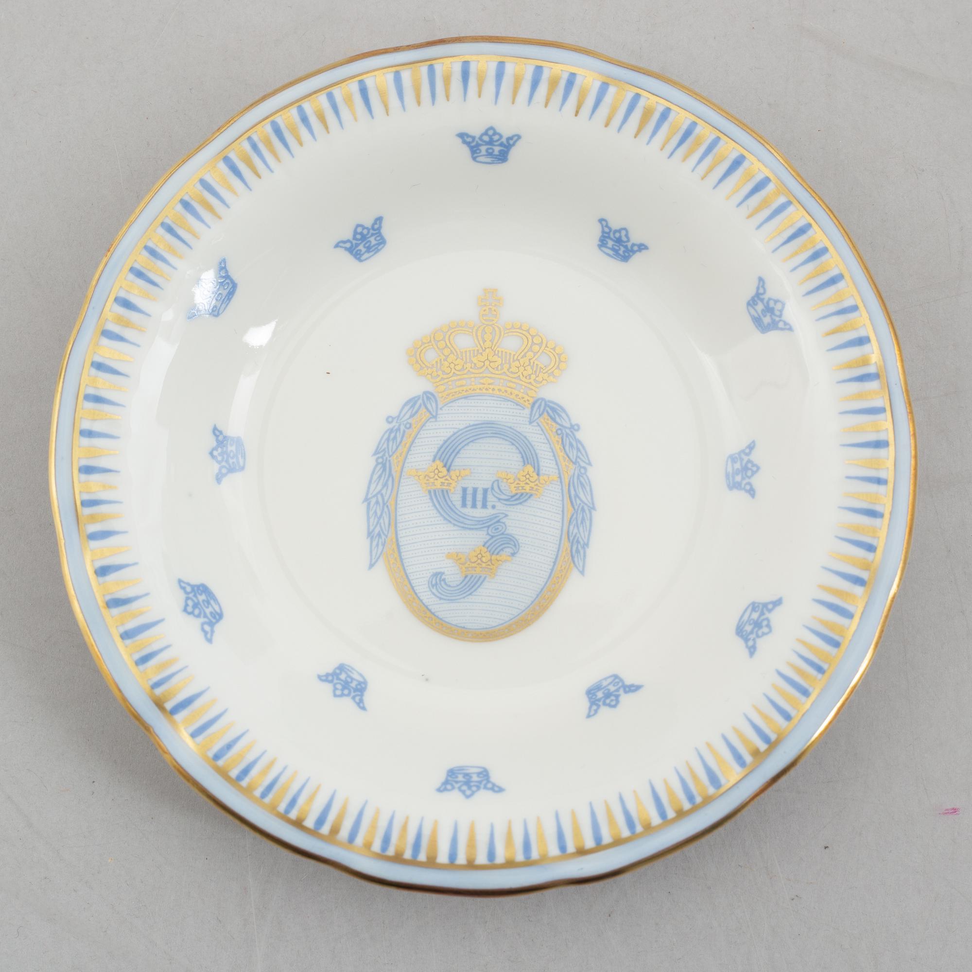 Twelve porcelain custard cups with covers and stands, Rörstrand, Sweden, second half of the 20th century.
