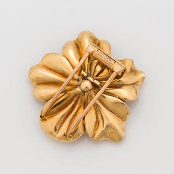 A flower brooch signed Cartier, set with an old cut diamond, circa 1.00 ct.