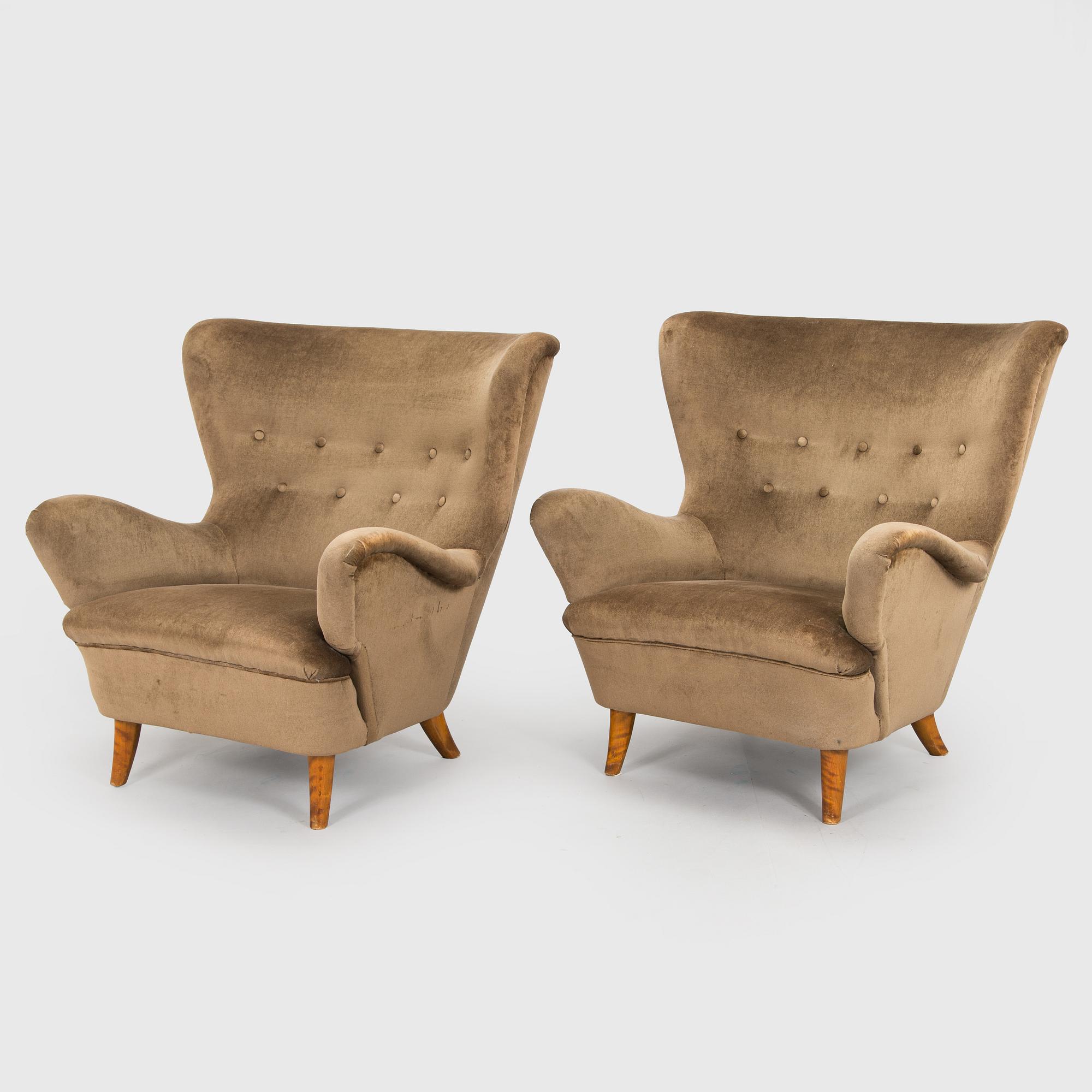A pair of mid-20th century armchairs.