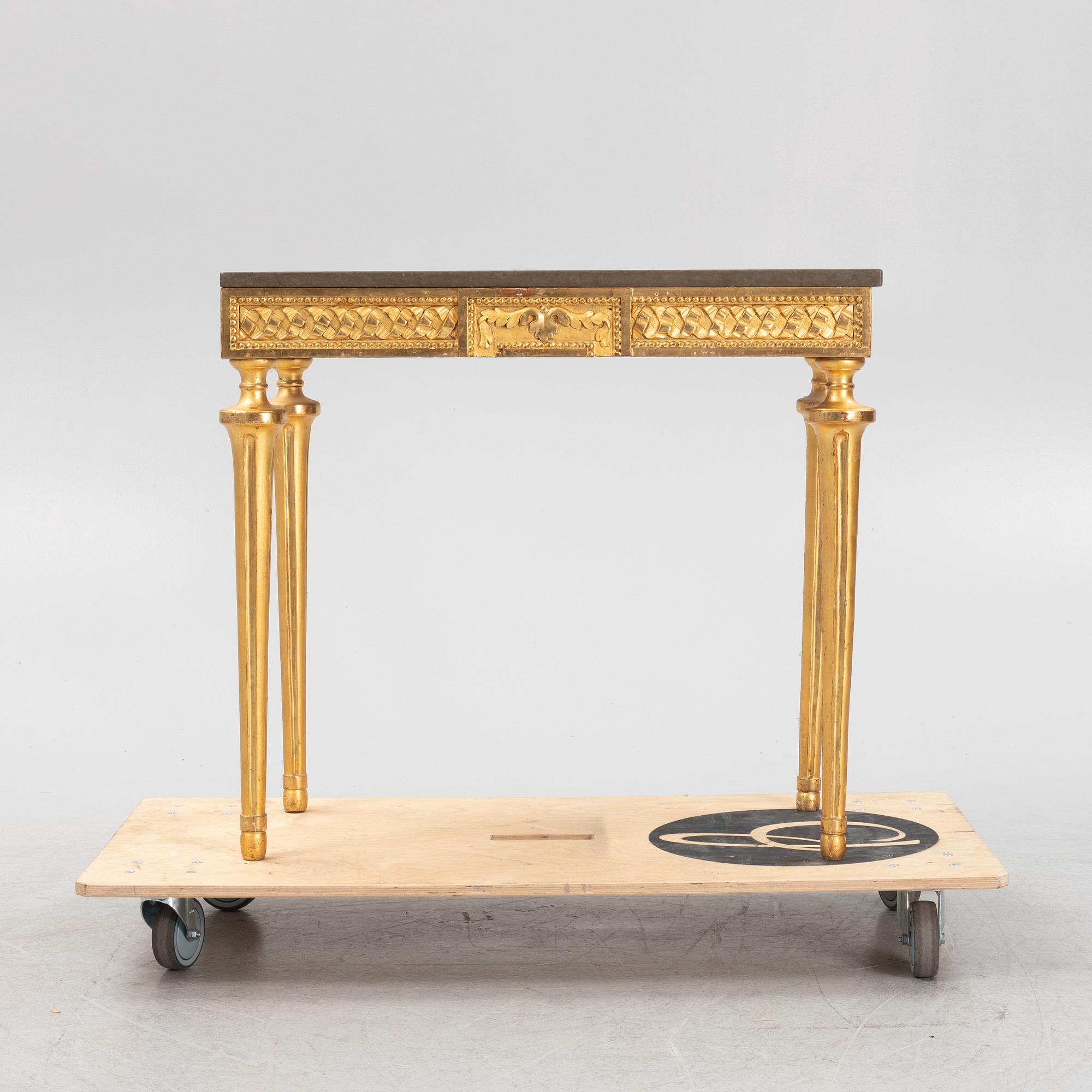 A console table with stone top.