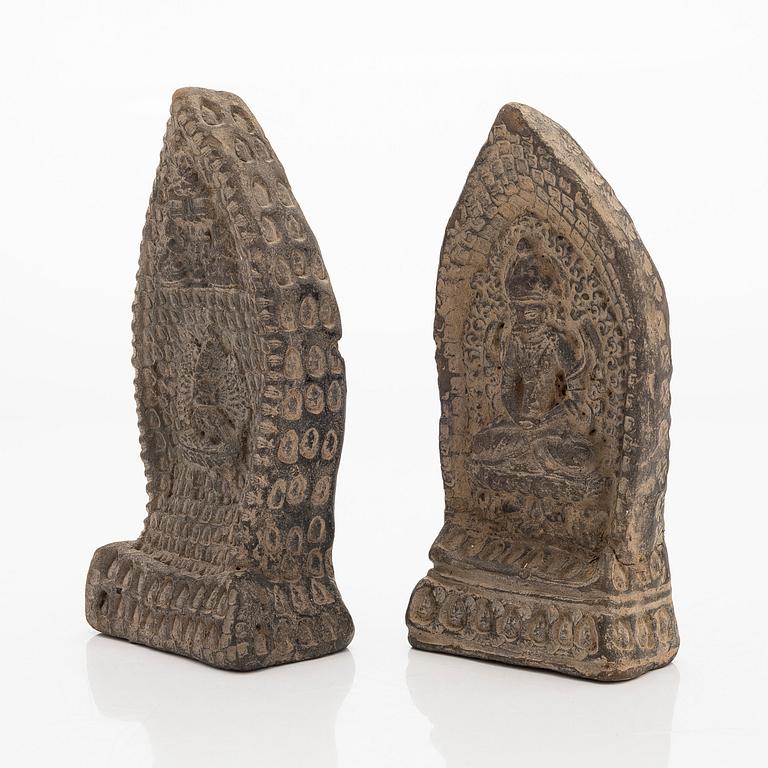 Two steles/tsa tsas, presumably circa 1900.