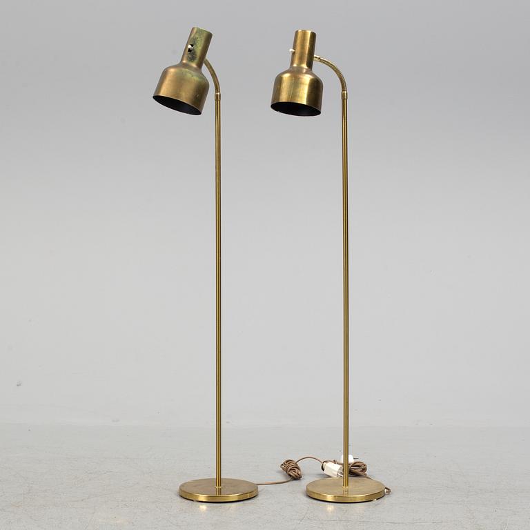 A pair of brass floor lamps, "MAE 27".
