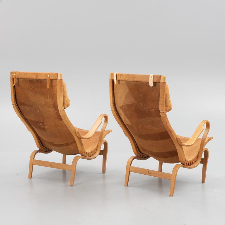 Bruno Mathsson, a pair of "Eva" armchairs, Karl Mathsson, Värnamo, 1973.