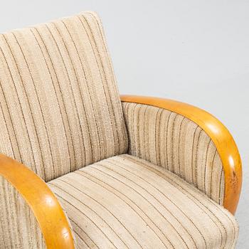 A pair of Swedish Modern easy chairs, Dux T-serie, 1940's/50's.