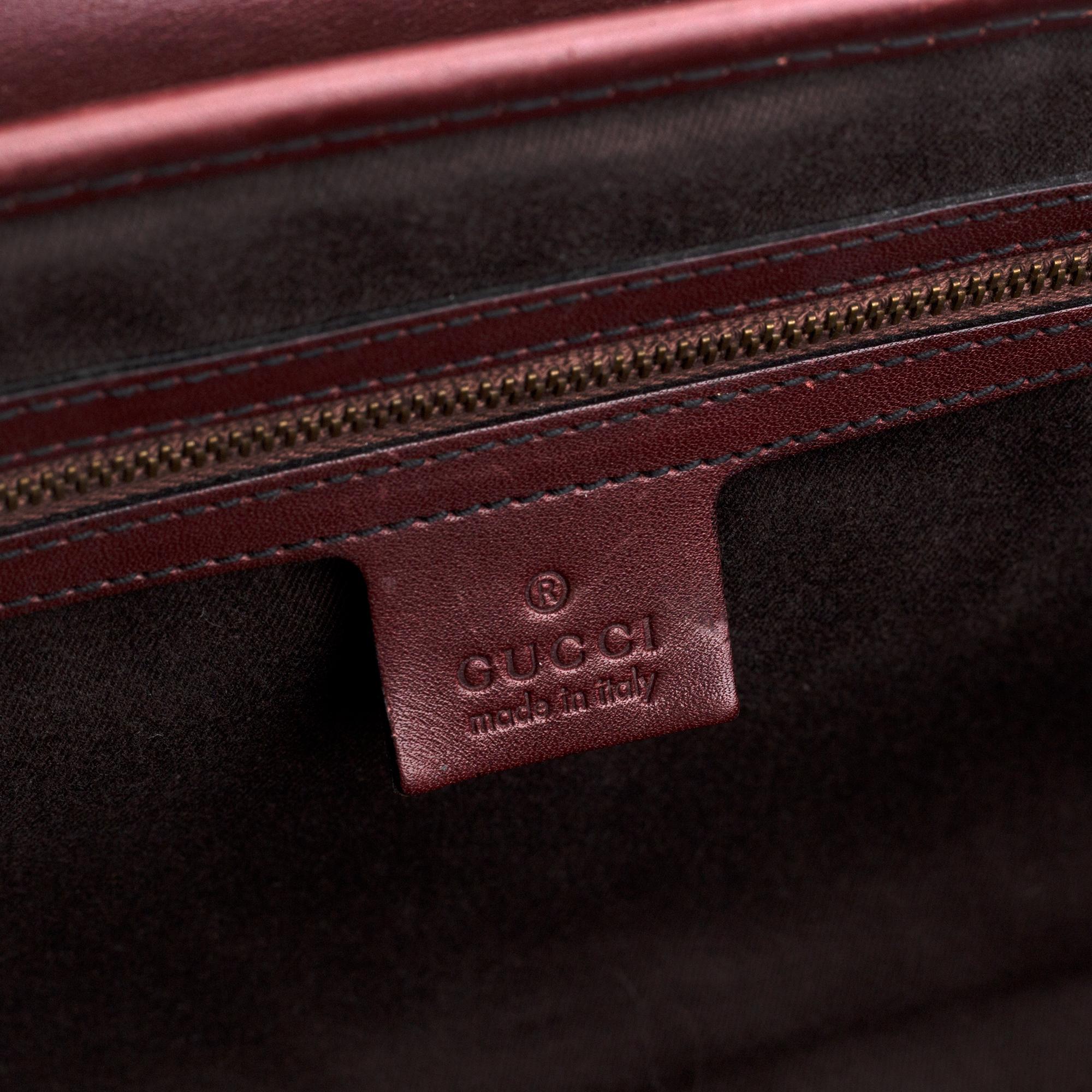 Gucci, a monogram canvas bag.