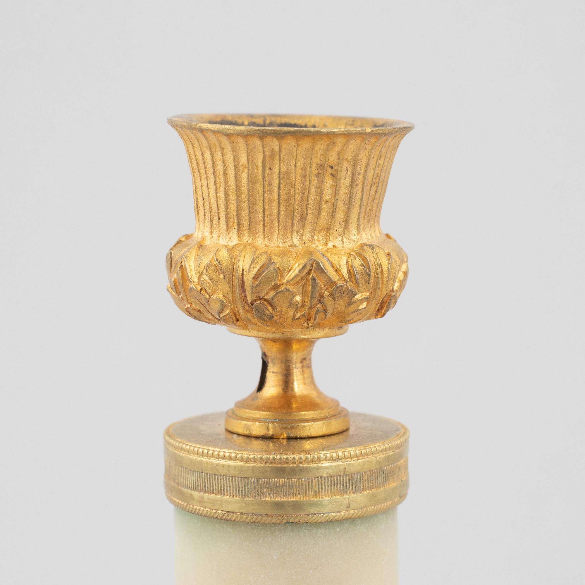 A pair of marble and gilt-bronze Louis XVI-style candelsticks, circa 1900.