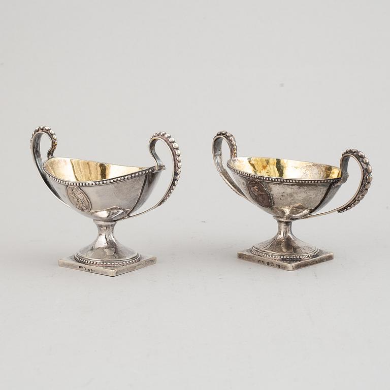 A matched pair of Swedish parcel-gilt silver salt-cellars, mark of A Floberg and PA Sjöberg, Stockholm 1799 and 1823.