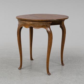 A rococo style card table from around year 1900.