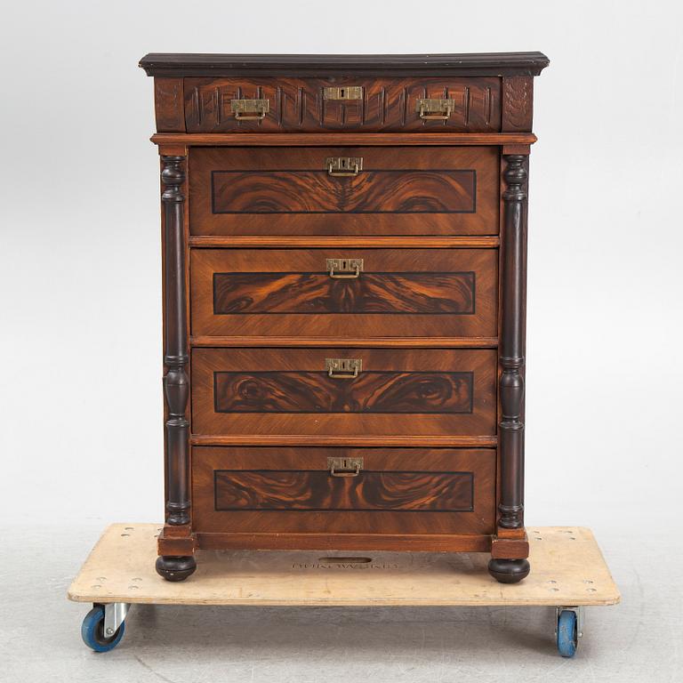 A chest of drawers, circa 1900.