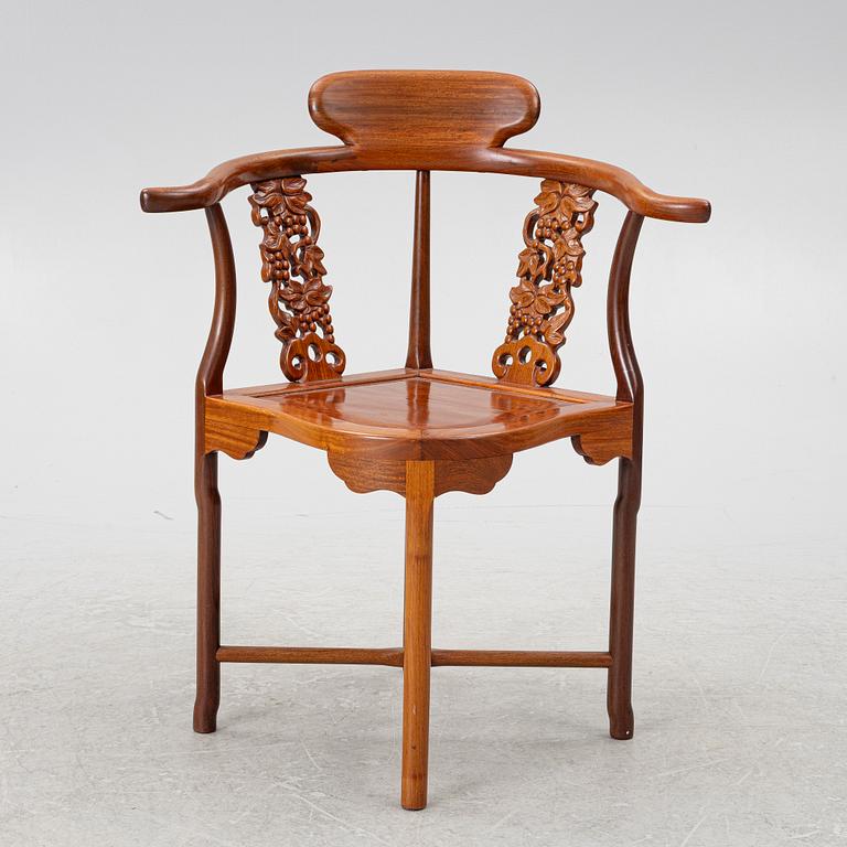 A Chinese hardwood corner armchair, 1900s.