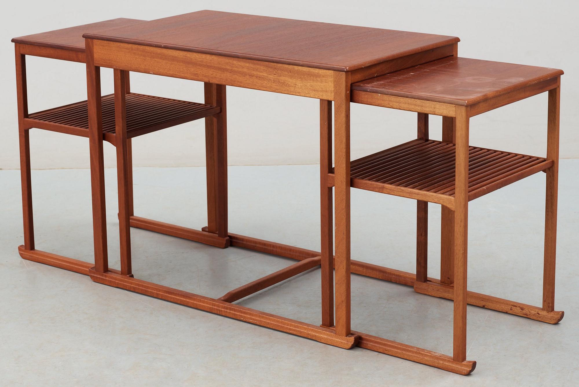 A Carl Malmsten teak set of occasional tables, manufactured by Åfors Möbelfabriks AB, Sweden.