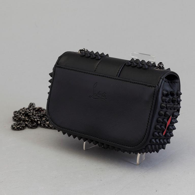 An eveningbag with studs by Christian Louboutin.