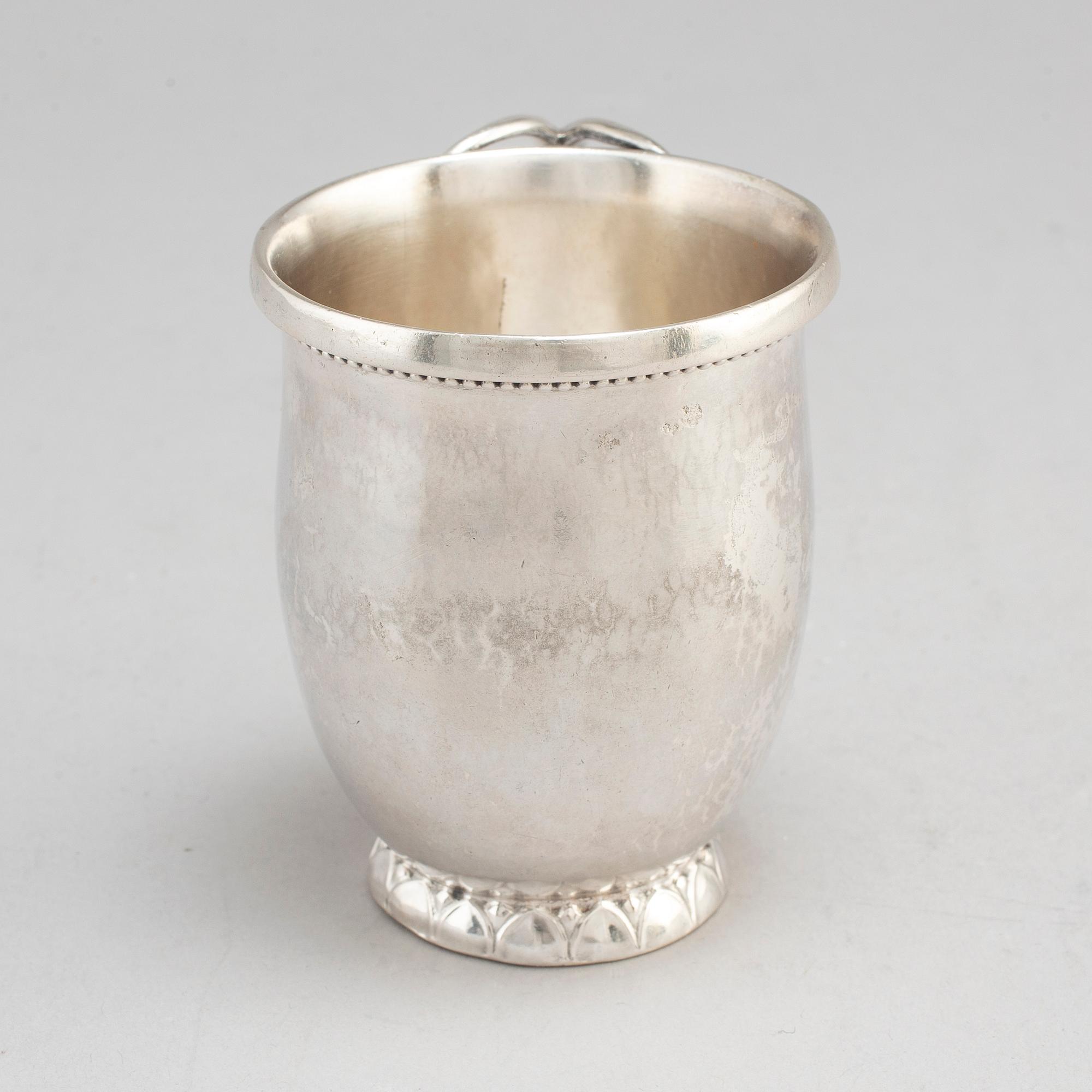 GEORG JENSEN,  a 830/1000 silver mug and  a bowl (a christening set), Copenhagen ca 1918-1927, design nr 127, 158.