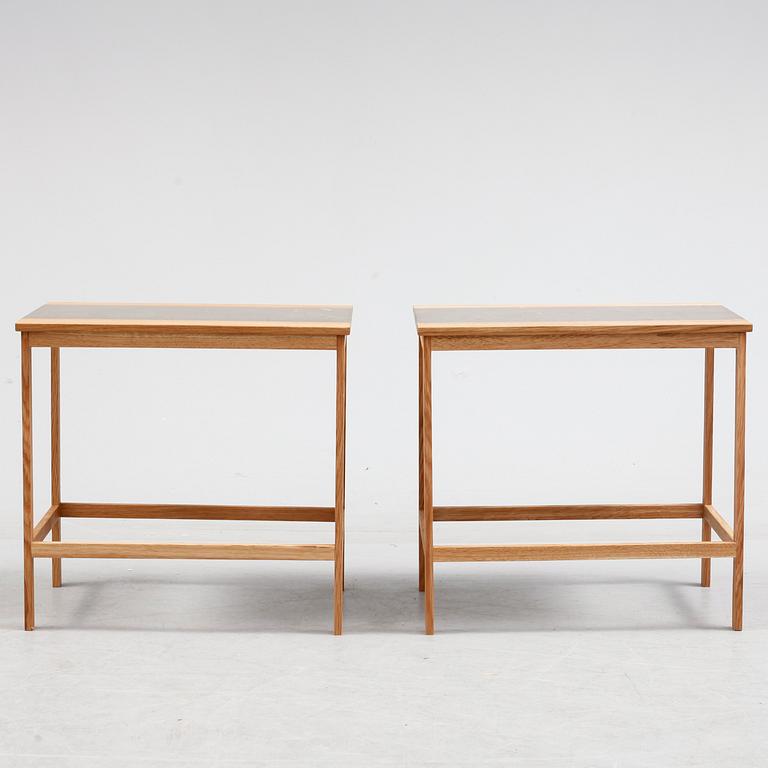 A pair of of oak and limestone tables, 21th century.