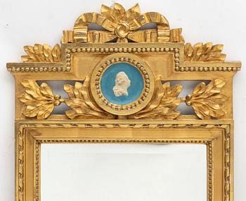A Gustavian style mirror by John Lundmark, early 20th Century.