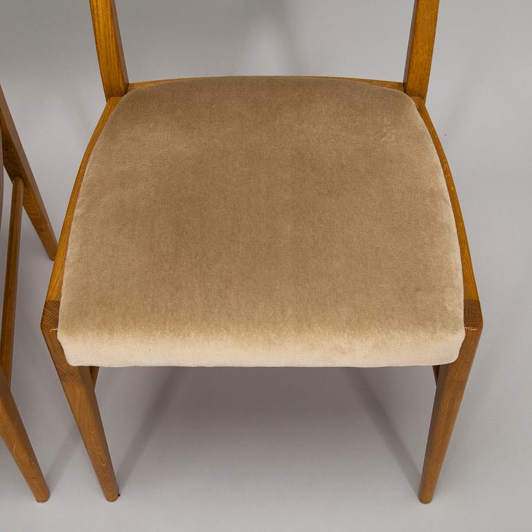 A set of four 1960s oak chairs.