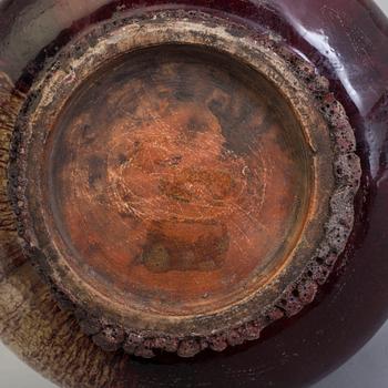 A large red glazed tripod censer, 20th century.