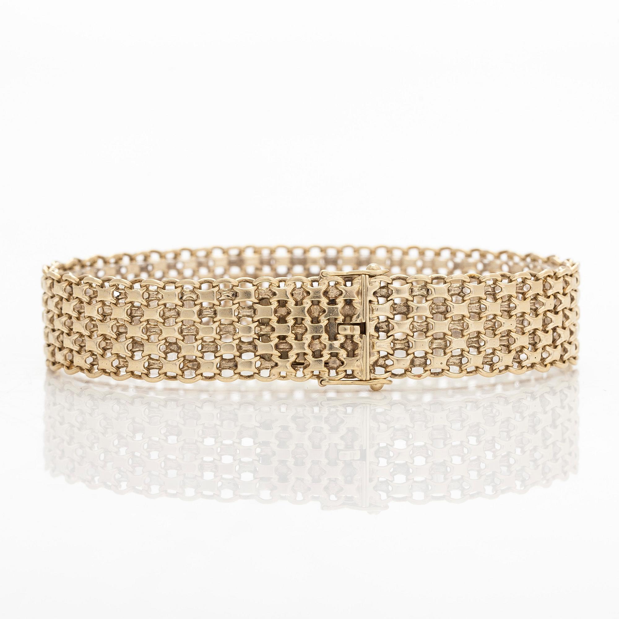 A 14K gold X-link bracelet, likely Norway.