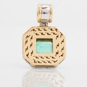 A pendant with a 5.50 ct emerald and cica 1.80 cts of brilliant cut diamonds.