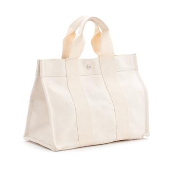 315. HERMÈS, a white canvas handbag.