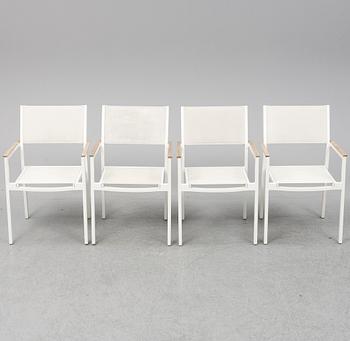 A garden table with four chairs, Gloster.