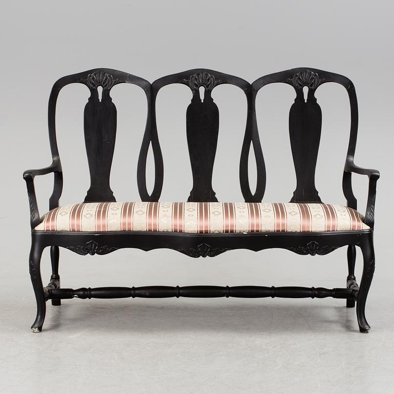 A mid 1900s rococo style sofa.