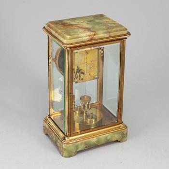 A French onyx and brass mantel clock, first half of the 20th century.