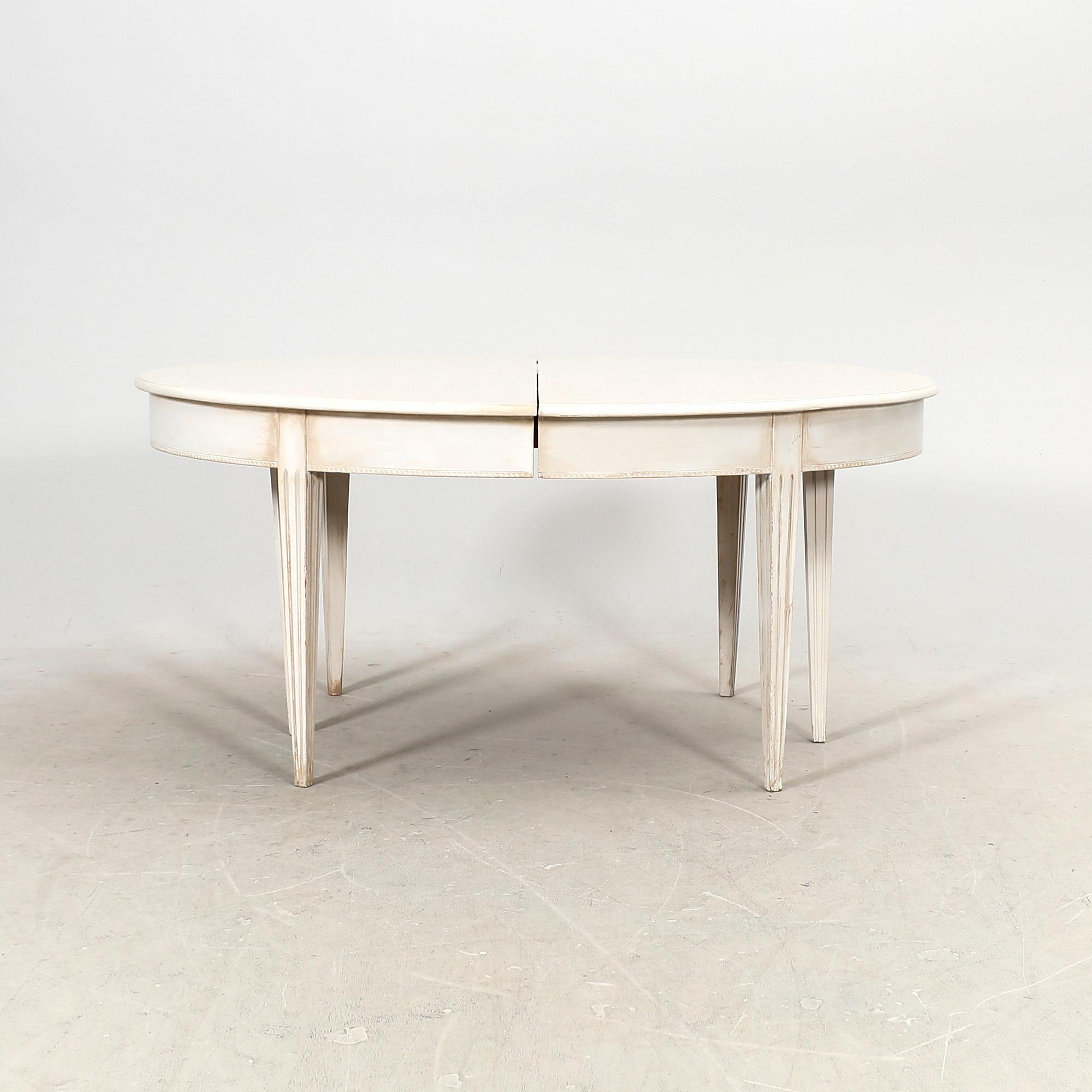 A painted 19th/20th Gustavian style dining table.