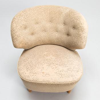 A mid-20th-century armchair.