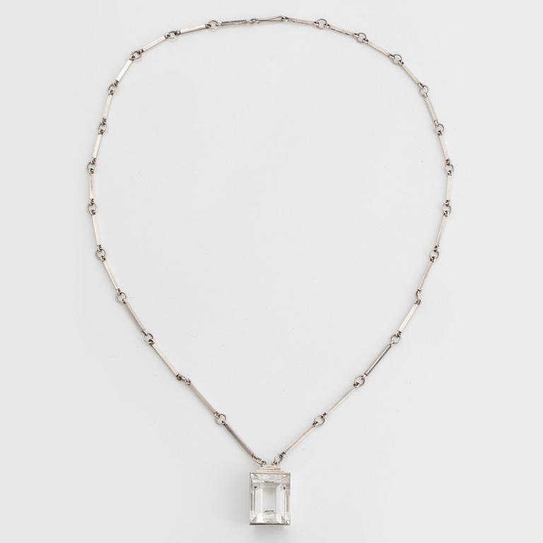 Wiwen Nilsson, a sterling silver necklace with a facet cut rock crystal pendant, Lund, Sweden 1943.