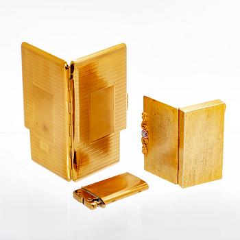 A set of three 20th century gold metal cigaret cases.