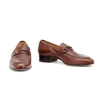 GUCCI, a pair of brown leather loafers.