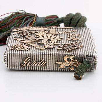 Silver box, gold, enamel, rose-cut diamonds, saphires and rubies (possibly synthetic), silk chord, St Petersburg.