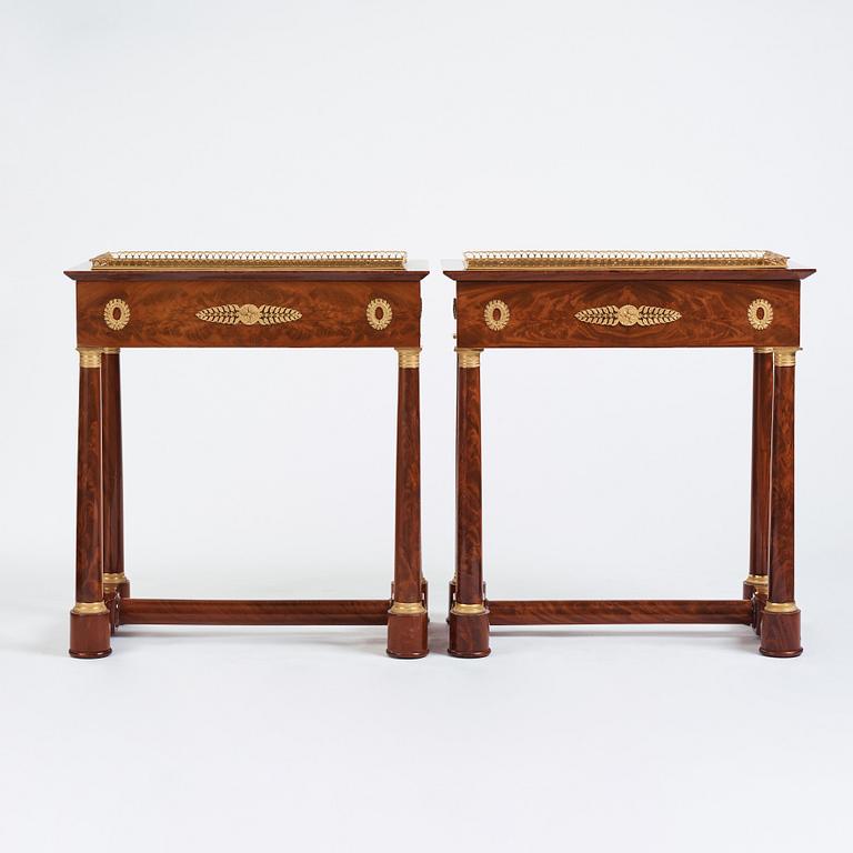 A pair of French Empire gilt bronze-mounted mahogany jardinieres, first half of the 19th century.