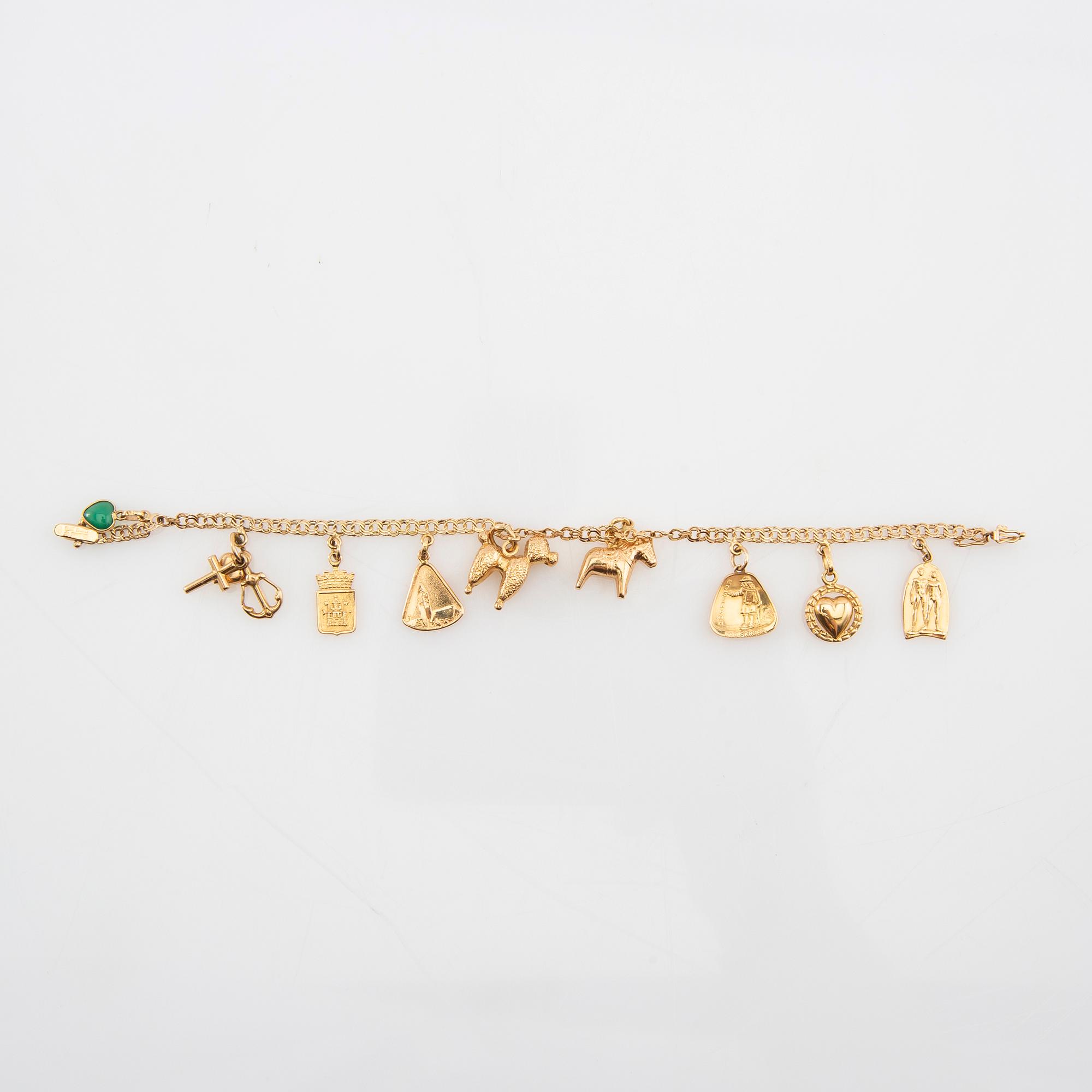 Armband Bismarck-länk 18K guld med berlocker.