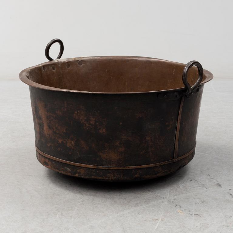 A 19th century copper cauldron.