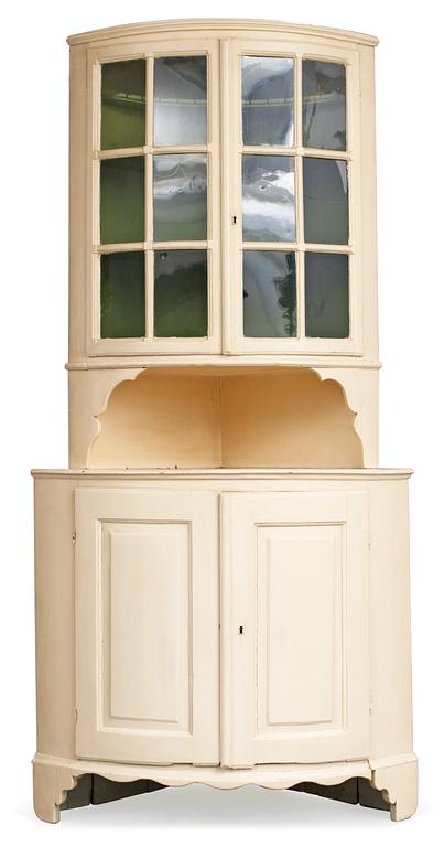 A Swedish Rococo corner cupboard.