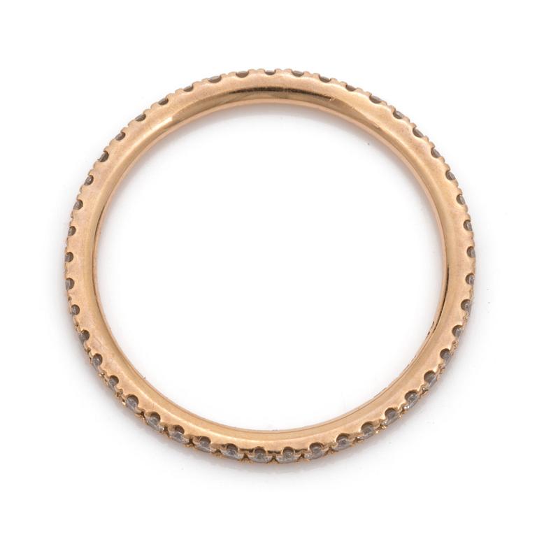 An eternity ring by Georg Jensen set with round, brilliant-cut diamonds.