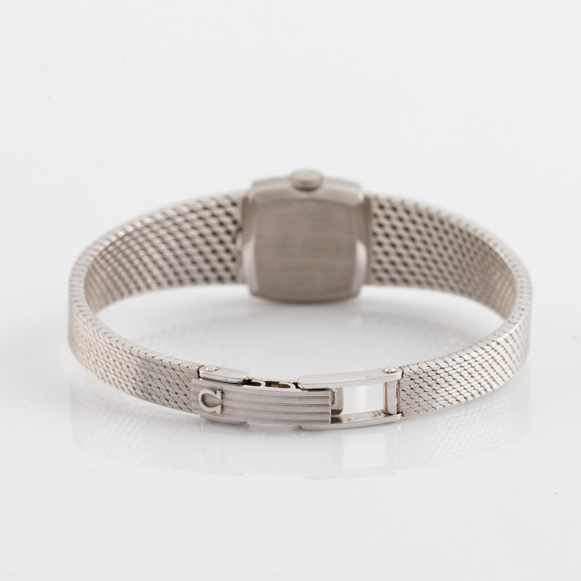 Omega, damarmbandsur, vitguld med åttkantslipade diamanter.