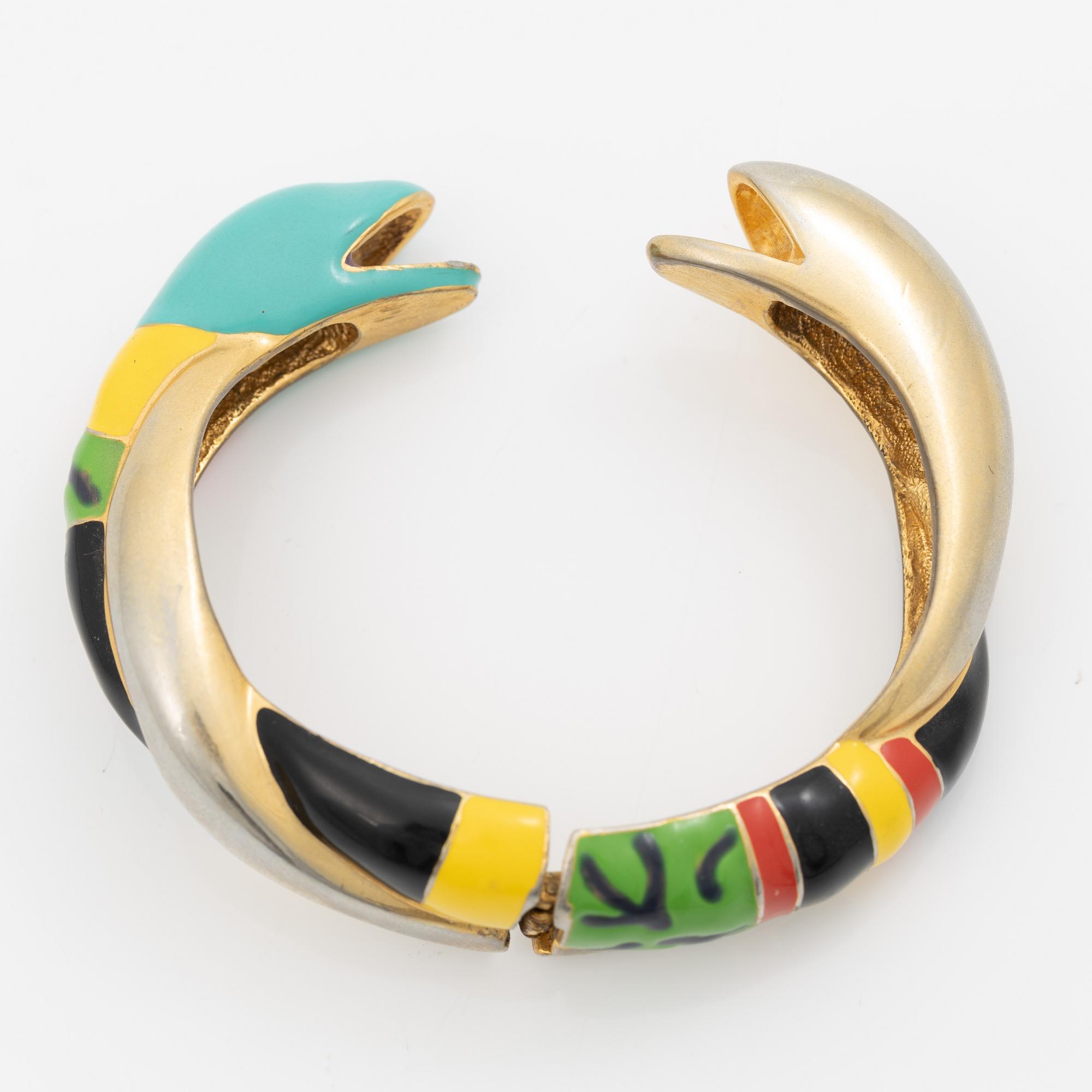 Niki de Saint Phalle , armband, "serpentine bracelet" guldfärgad metall med emalj.