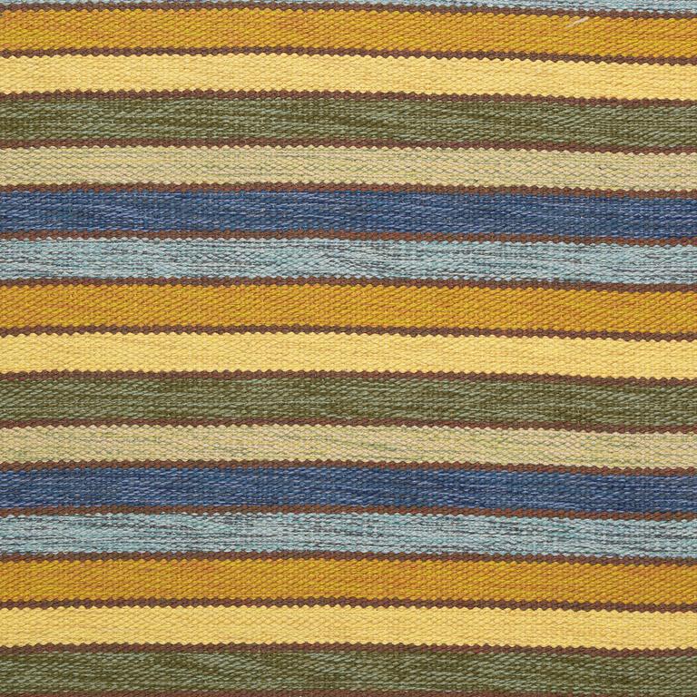 A flat weave runner, c. 580 x 90 cm.