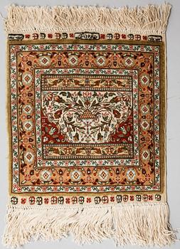 Four silk rugs/pads, probably Hereke, ca 33 x 33 cm.