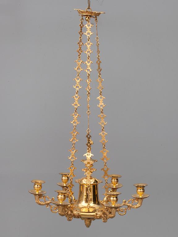 A CHANDELIER, For sex candles. Fire gilded. Empire style, early 19th century.