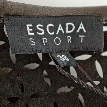 ESCADA SPORT, a black openwork leather dress.