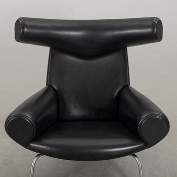 HANS J WEGNER, "Ox chair" lounge chair and stool.