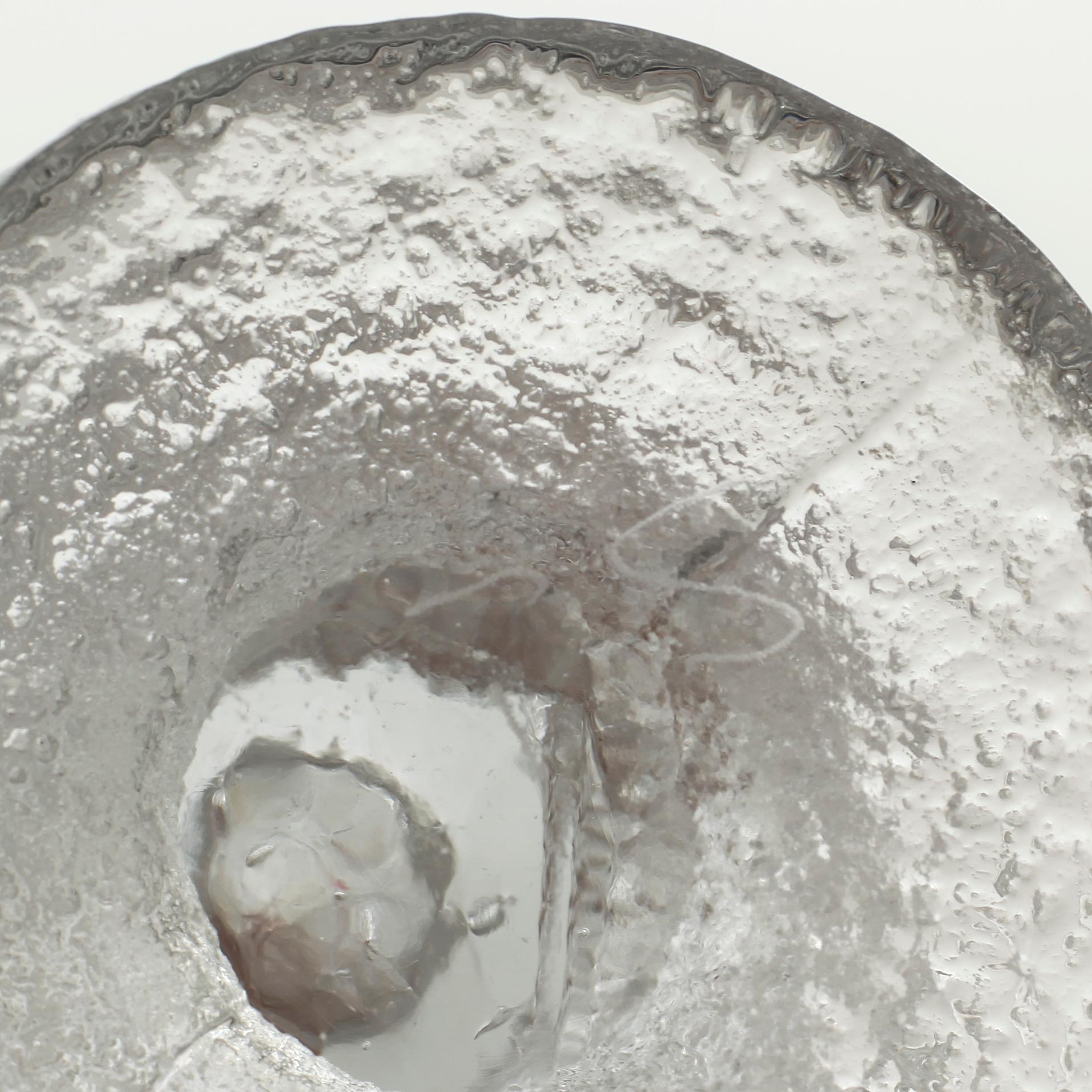 Five glass candlesticks by Timo Sarpaneva for Iittala, model "Festivo", second half of the 20th century.