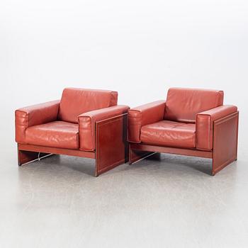 A pair of armchairs by Tito Agnioli for Matteo Grassi, second hal of the 20th century.