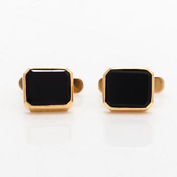 A pair of cufflinks and three shirt buttons,  18K gold and onyx.