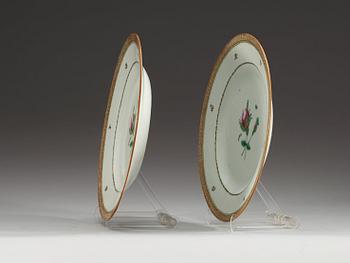 A pair of famille rose dinner plates, Qing dynasty, Qianlong (1736-95), dated 1789.